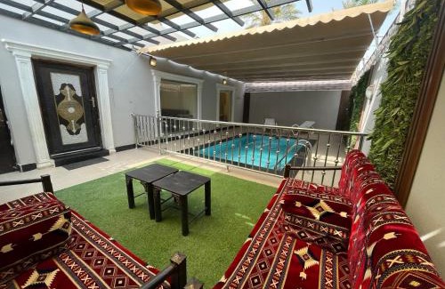 Al Aqiq Chalet De Esquí | شاليه وحديقة التوت بمسبح
