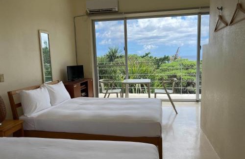Ishigaki Cabina | 青の洞窟 'Blue in Green' 青の洞窟が目の前のコテージ! Ocean view & 満天の星! 広々セミダブルベッド