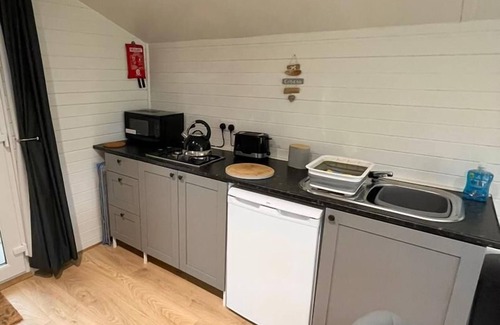 Corwen Cabina | 1 Bedroom Log Cabin in Parc Pen y Bryn Sleep 2/3