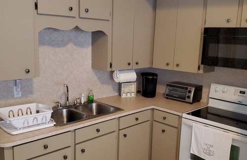 Spanish Wells Apartamento | 100ft from the most beautiful beach and crystal clear water, with free golf cart