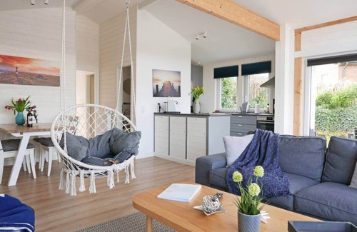 Ruckeberg Casa | 100m away from the beautiful Schlei, you will find our extensively renovated and modern bungalow "Schlei-Idyll" with maritime details, as well as a small garden area with terrace for your well-deserved time out