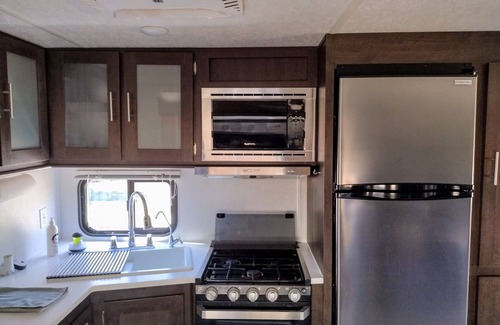 Plantersville Casa | 1BR 32' RV by Pond, Clean, Safe and Affordable with Playground and Pool.