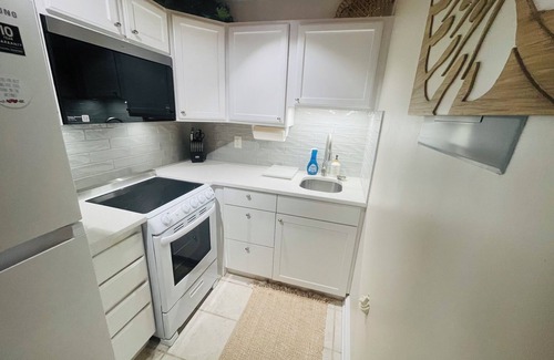 Emerald Isle Casa | 1BR beach getaway: pool, pier, sunset views. Full amenities. Near beach access.