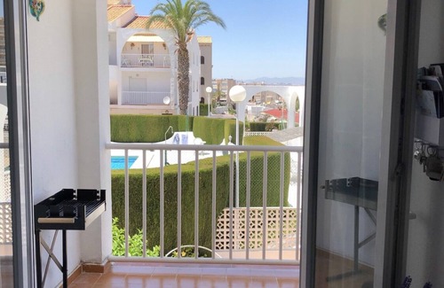 Torrevieja Apartamento | Apartamento con piscina, balcón y vistas al mar, ¡a solo 400 metros a pie de la playa de La Mata!