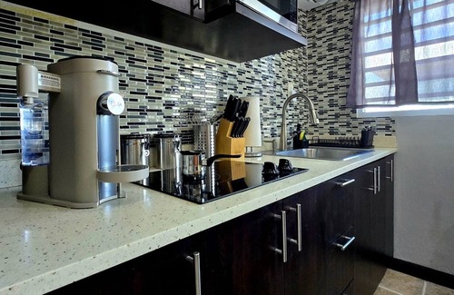 Sabana Abajo Condominio | 2-bedroom condo in charming Carolina with WiFi, AC. 4 min walk to beach!