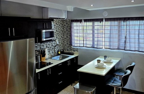 Sabana Abajo Condominio | 2-bedroom condo in charming Carolina with WiFi, AC. 4 min walk to beach!