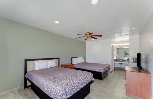 Eastside Promise Neighborhood Hotel | 2 Family-Friendly Rooms Near DT Entertainment Venues w/ Free Breakfast