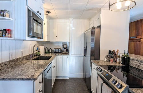 Gilford Casa | 2 Lake Winnipesaukee waterfront homes, 2 boat slips, dogs welcome, hosts 18