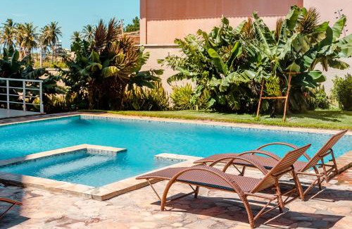 Porto das Dunas Apartamento | 2 QUARTOS em CONDOMÍNIO TRANQUILO com PISCINA Estacionamento coberto – PARQUINHO para CRIANCAS - Cozinha Completa, VENTILADO, nascente, AR CONDICIONADO – 800m da praia do PORTO DAS DUNAS e BEACH PARQUE - Ceará