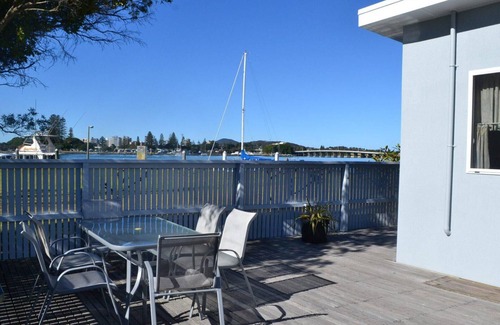 Tuncurry Cabaña | 2 Rockpool Road una casa de campo frente al mar