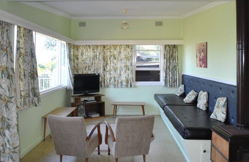 Tuncurry Cabaña | 2 Rockpool Road una casa de campo frente al mar