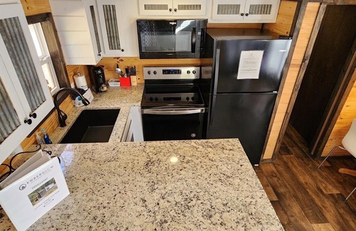 Mill Spring Casa | 2-story tiny home nestled on the creek, quick walk to pool and playground, private firepit, sleeps 7.
