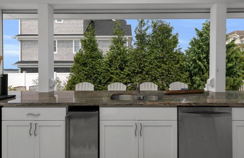 Monmouth Beach Casa | 2023 home on river, across from Beach. Outdoor kitchen bath pool spa fireplace