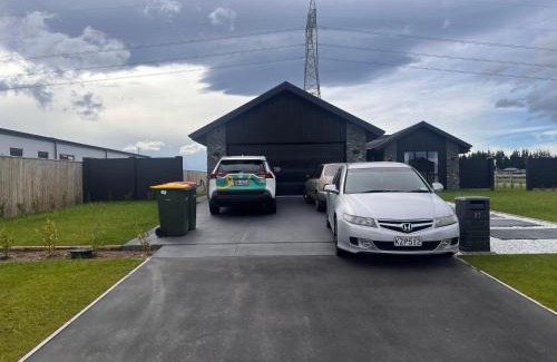 West Melton Casa | 23 Texel Crescent Black brick house