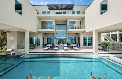 Bodden Town Villa | 25% Off! 7BR Oceanfront Villa w/ 5 Master Suites, Bunk Room, Swim-Up Bar