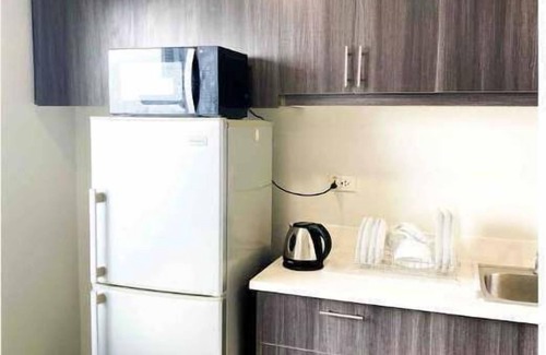 Valencia Apartamento | 2BR in Gilmore near Robinsons Magnolia w/ Parking