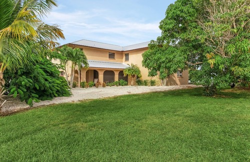 Bokeelia Casa | 3/2 in Bokeelia with INCREDIBLE GULF ACCESS, BOAT SLIP INCLUDED! ​​​​​​​Spacious upstairs unit with amazing porch overlooking canal!