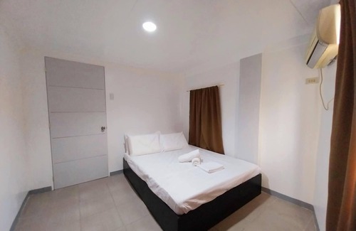 Suba Basbas Casa | 3-Bedroom Pacific Grand Townhome in Masulog, Lapu-Lapu with WiFi & Full AC Rooms