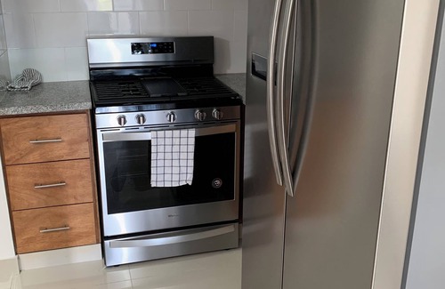 Santo Domingo Condominio | 4-bedroom condo Steps from Ocean w/Pier, parking, WiFi, AC, parks & shopping.