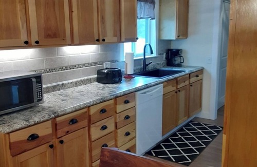 Tawas City Casa | 4-bedroom home in Tawas City with indoor pool and game room across from L Huron