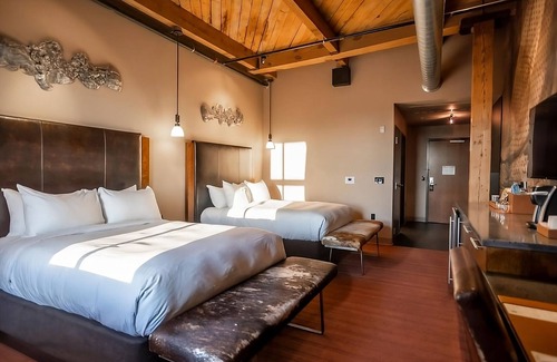 Fifth Ward Hotel | 4 Custom Deluxe 2 Queen Beds at The Iron Horse Hotel, Bring Along Your Pets!