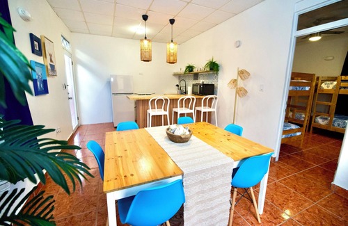 Mayaguez Pueblo Apartamento | 5.9 Purple Casita w/ historic balcony