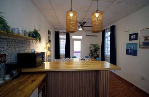 Mayaguez Pueblo Apartamento | 5.9 Purple Casita w/ historic balcony