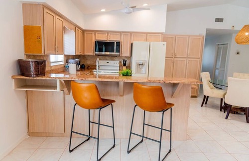 Naples Park Casa | 690 Paradise Shores Oasis | New Heated Pool & Spa