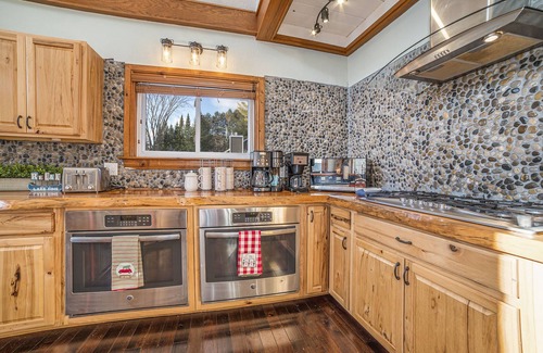 Gaylord Chalet De Esquí | 7K Sqft Lakefront Escape, Sandy Beach, Barrel Sauna, Game Room, Fire Pit