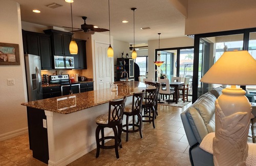 South Gulf Cove Casa | A 100+ reviews Family friendly home on canal with gulf access and heated pool!