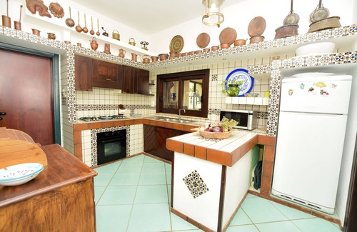 Porto Palo Villa | A balcony on the beach, swimming pool, lush parkland
