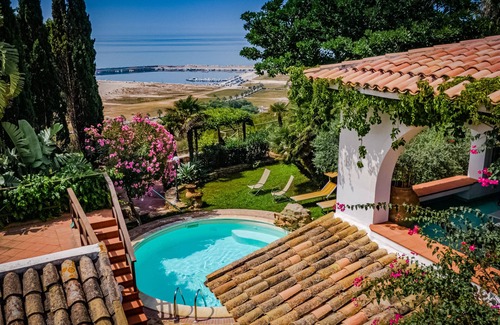 Porto Palo Villa | A balcony on the beach, swimming pool, lush parkland