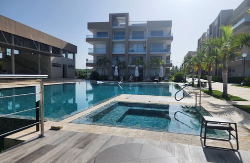 San Pedro de Macoris Apartamento | A dreamy vacation apartment, steps from private beach.