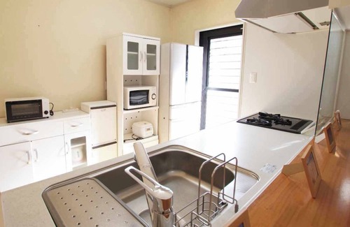 Amami Casa | A guesthouse limited to one couple. Conveniently located in the center of Amami Oshima for sightseeing. 30 seconds to the largest downtown area, Yajin River. Fully equipped kitchen and laundry facilities are available for long-term stays.