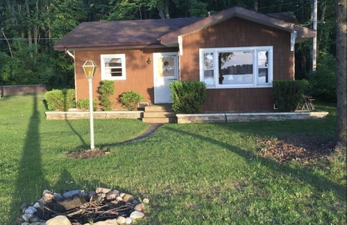 Pentwater Cabaña | A peaceful little lakefront house on the sunset side of Bass Lake!