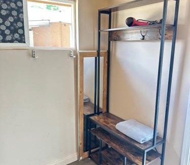 Norwalk Casa | A small room in the backyard with a full bed