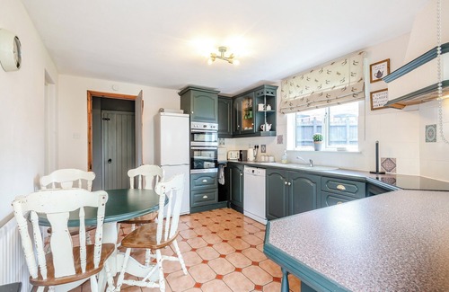 Saxthorpe Cabaña | A spacious, bright property with a large inglenook fireplace and lovely furnishings.