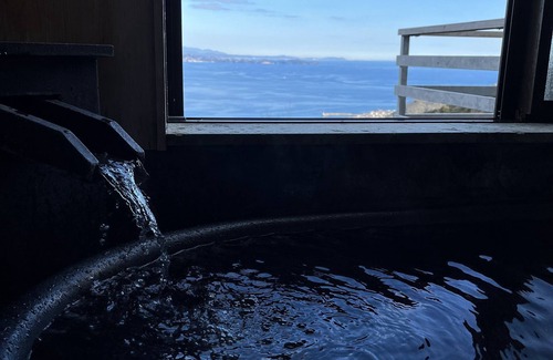 Shimotaga Casa | A spectacular view! Relax on the sea-view terrace / Scandinavian log house with hot spring & fireplace