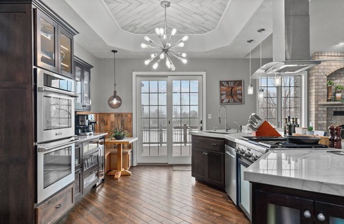 Forest Junction Casa | A warm & inviting modern retreat featuring on-site local brews & a home theater.