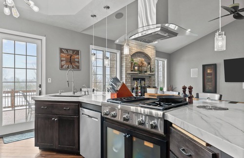 Forest Junction Casa | A warm & inviting modern retreat featuring on-site local brews & a home theater.