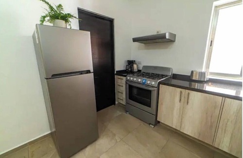 Alfredo V. Bonfil Apartamento | Airport condo w/ KING BED pool, security, kids game park + bbq area with lounge!