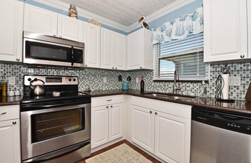 New Smyrna Beach Casa | "All Decked Out NSB" Ocean Views, Private Fenced Yard, BBQ, Bikes, Beach toys