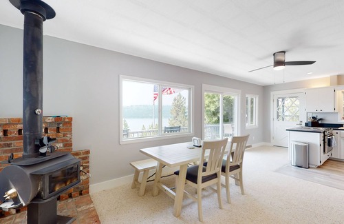 Harrison Casa | Amazing lake-view cabin with balcony, firepit, grill, wood stove, & W/D