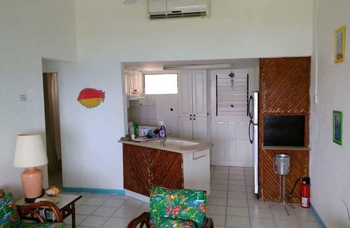 Crown Point Apartamento | Impresionantes vistas al mar desde este apartamento en Store Bay Beach.