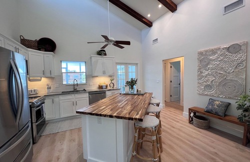 Bokeelia Casa | Antigua Cay Retreat is a stylish home with pool on deep water canal in Bokeelia