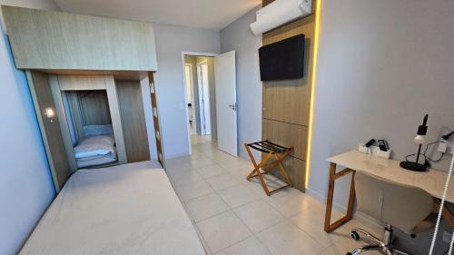 Vila Anhanguera Apartamento | Ap frente mar com ar-condicionado e varanda gourmet