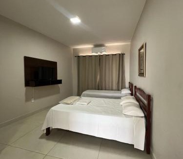 Patos de Minas Apartamento | Apartamento 102 - Suíte com ar condicionado