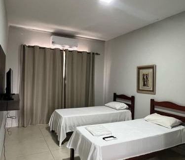 Patos de Minas Apartamento | Apartamento 110 - Suíte com ar condicionado