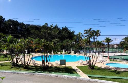 Balneario Cidade Atlantica Casa | Apartamento até 10 pessoas na enseada Guarujá em condomínio clube praia piscinas salão jogos quadra futebol campo parquinho brinquedos Wi-fi Home office