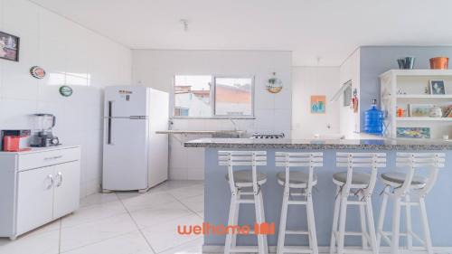 Morada da Praia Apartamento | Apartamento em Bertioga com vista para o mar